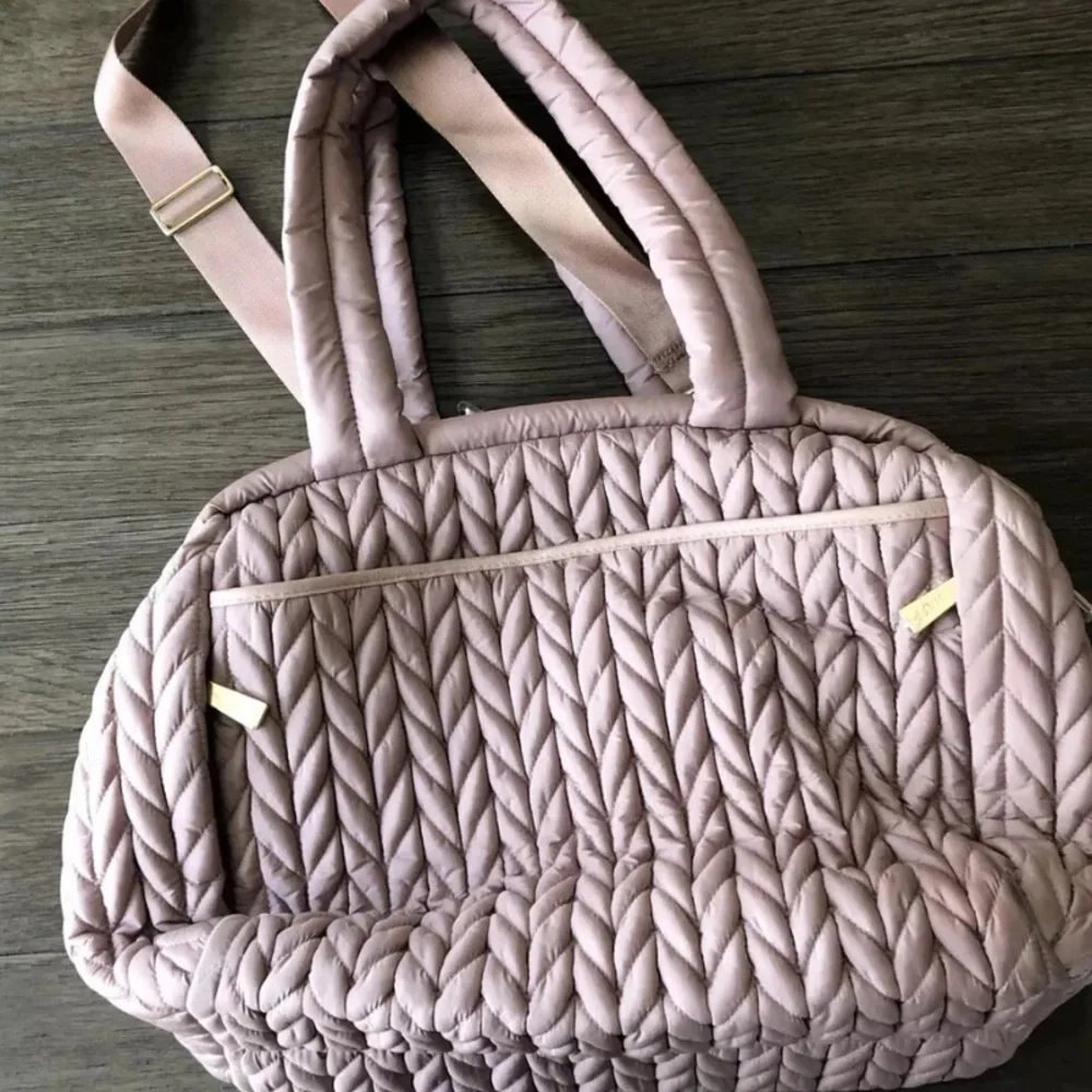 Pre owned Happ Brand Paige Caryall Diaper bag slight stain I can see in pic